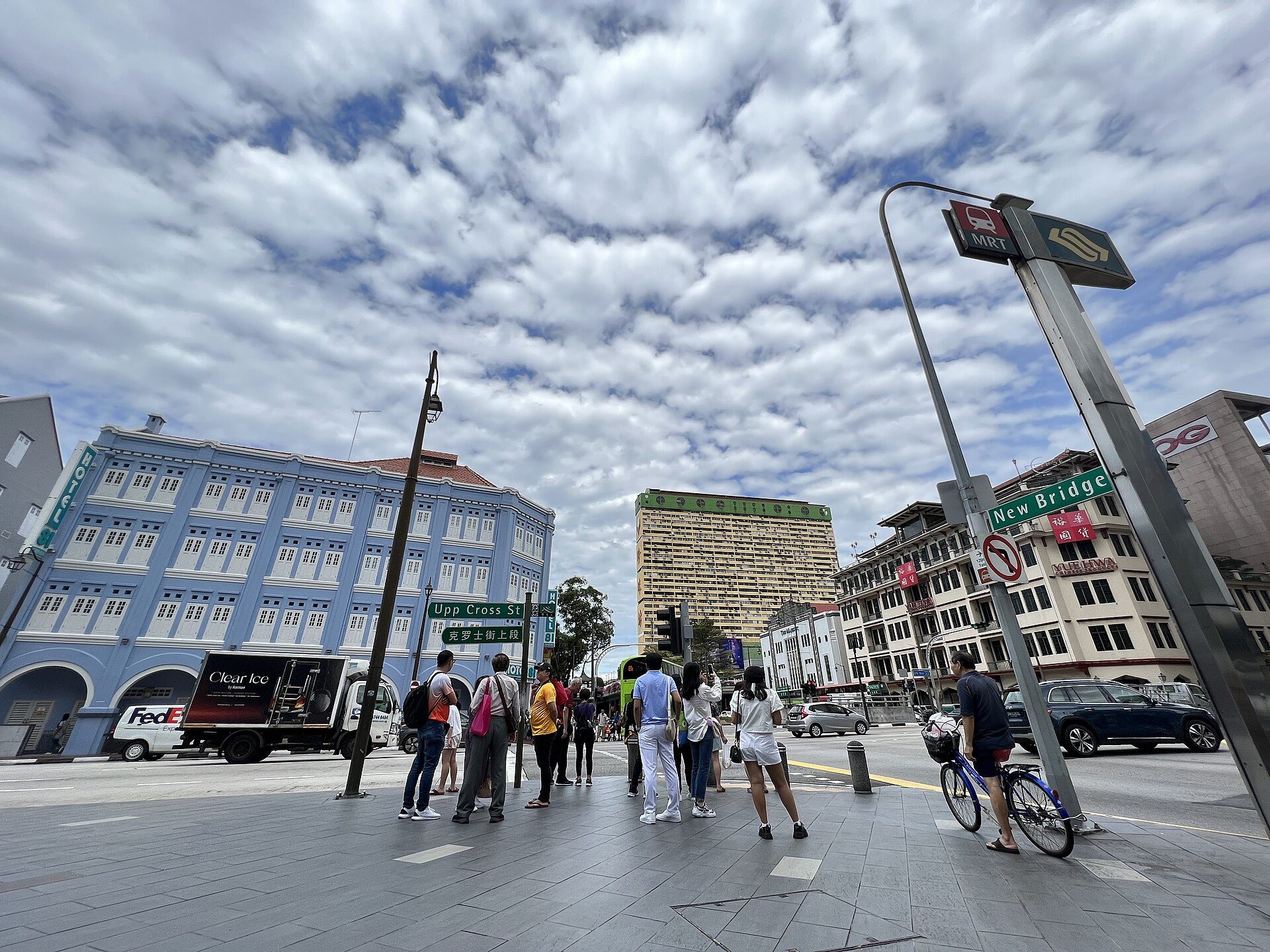 Upper Cross Street meeting New Bridge Road in Chinatown, Singapore, under a cloudy sky